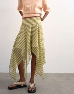 Model wearing Hanky hem mini skirt in green stripe