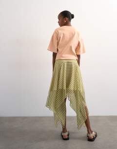 Model wearing Hanky hem mini skirt in green stripe