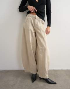 Model wearing Harper baggy barrel jean in winter oat