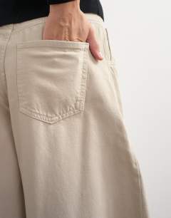 Model wearing Harper baggy barrel jean in winter oat