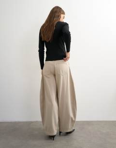 Model wearing Harper baggy barrel jean in winter oat