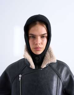 Model wearing Hayley button balaclava in black
