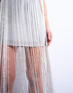 Model wearing Heavy beaded fringe mini dress in silver