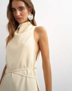 Model wearing Heavy crepe high cowl neck mini dress with tie waist in cream