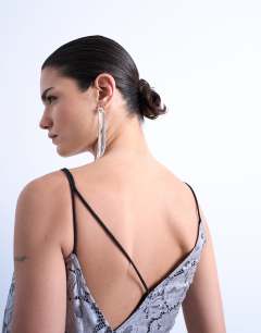 Model wearing Heavy foiled lace maxi dress in silver