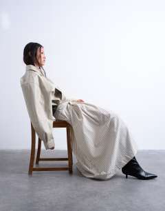Model wearing Heavy pleated maxi full circle skirt in woven mono stripe