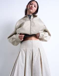 Model wearing Heavy pleated maxi full circle skirt in woven mono stripe