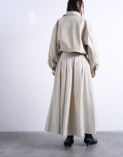 Model wearing Heavy pleated maxi full circle skirt in woven mono stripe