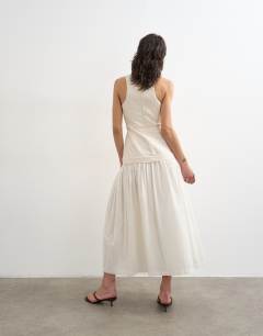 Model wearing Heavy twill dropped waist maxi dress with full skirt in natural