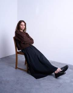 Model wearing Heavy twill full hem midi skirt in black