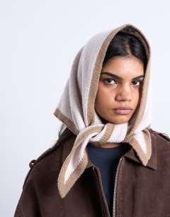 Model wearing Heidi knitted headscarf in cream & taupe