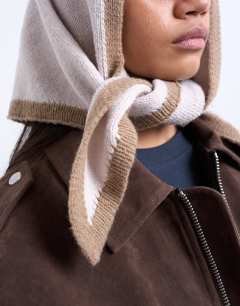 Model wearing Heidi knitted headscarf in cream & taupe