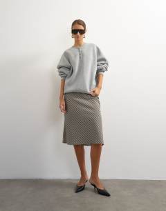 Model wearing Henley button detail sweat in grey marl