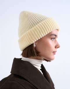 Model wearing Henry ribbed beanie in buttermilk