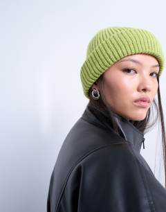 Model wearing Henry ribbed beanie in green