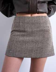Model wearing Herringbone mini pelmet skirt in mono