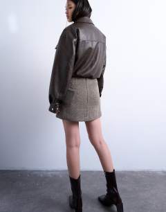 Model wearing Herringbone mini pelmet skirt in mono