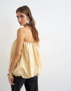 Model wearing High low bubble hem bandeau in taupe stripe