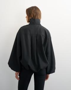 Model wearing High neck balloon hem top in black