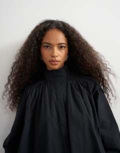 Model wearing High neck balloon sleeve shirt in black
