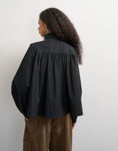 Model wearing High neck balloon sleeve shirt in black