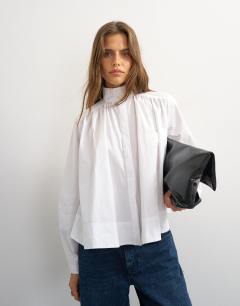 Model wearing High neck balloon sleeve shirt in white