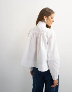 Model wearing High neck balloon sleeve shirt in white