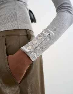 Model wearing High neck button rib long sleeve top in grey marl