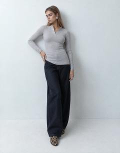 Model wearing High neck button rib long sleeve top in grey marl