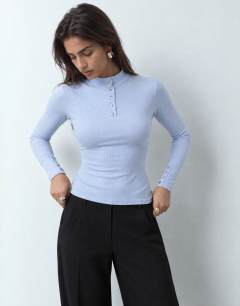 Model wearing High neck button rib long sleeve top in light blue