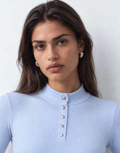 Model wearing High neck button rib long sleeve top in light blue