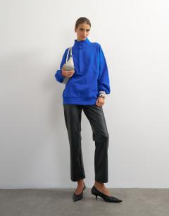 Model wearing High neck concealed placket sweat in colbalt