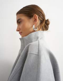 Model wearing High neck concealed placket sweat in grey marl