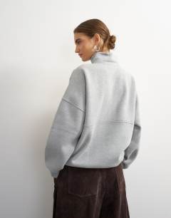 Model wearing High neck concealed placket sweat in grey marl