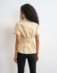 Model wearing High neck curved placket shirt in taupe stripe