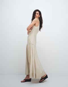 Model wearing High neck dropped waist maxi dress in natural stripe