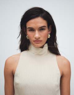 Model wearing High neck dropped waist maxi dress in natural stripe