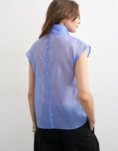 Model wearing High neck grown on shoulder sheer organza top in cornflour blue