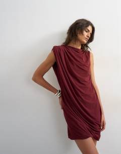 Model wearing High neck mesh draped mini dress in burgundy
