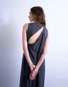 Model wearing High neck open back chuck on cupro midi dress in charcoal