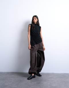 Model wearing High neck ruched channel tunic top in black