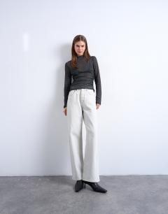 Model wearing High neck ruched polka dot print long sleeve top in black