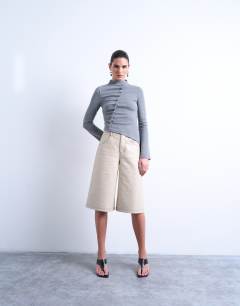 Model wearing High neck ruffle button long sleeve top in grey marl