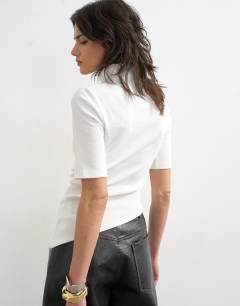 Model wearing High neck ruffle button through half sleeve top in ecru