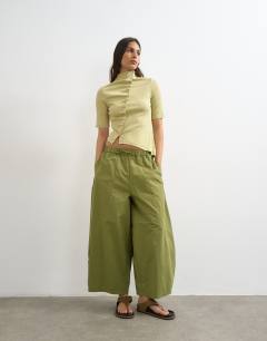 Model wearing High neck ruffle button through half sleeve top in soft lime