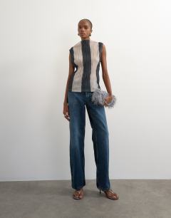 Model wearing High neck sleeveless plisse top in mono stripe