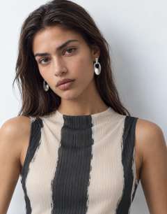 Model wearing High neck sleeveless plisse top in mono stripe