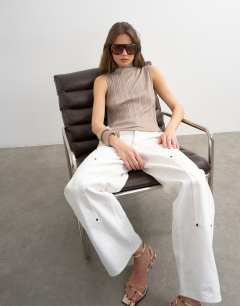 Model wearing High neck sleeveless plisse top in oat