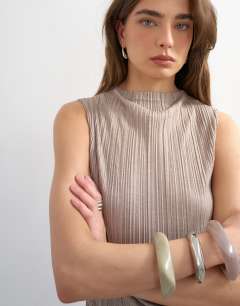 Model wearing High neck sleeveless plisse top in oat