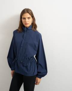 Model wearing High neck toggle detail jacket in navy